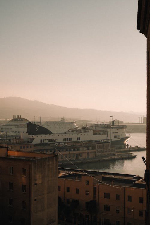 A view of a harbor and buildings from a window