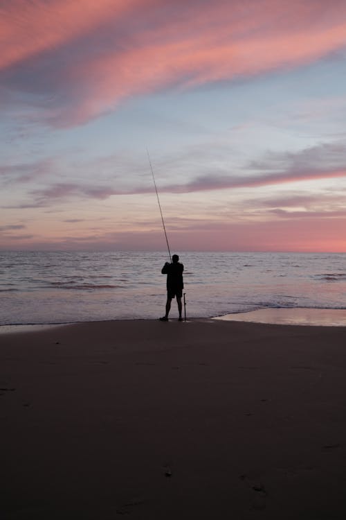 Foto profissional grátis de areia, beira mar, cair da noite