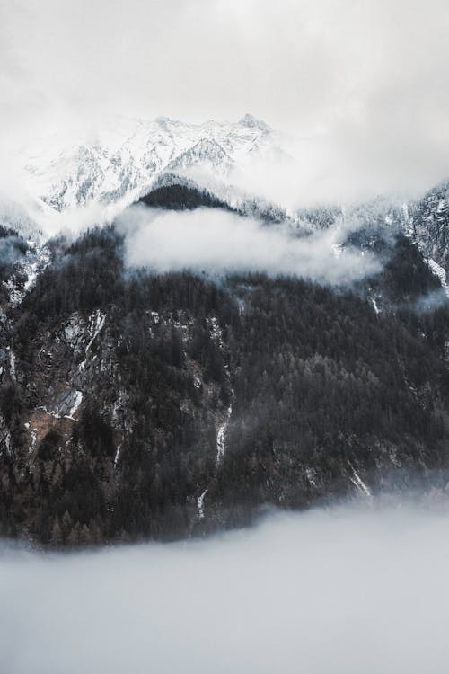 A mountain covered in fog and snow