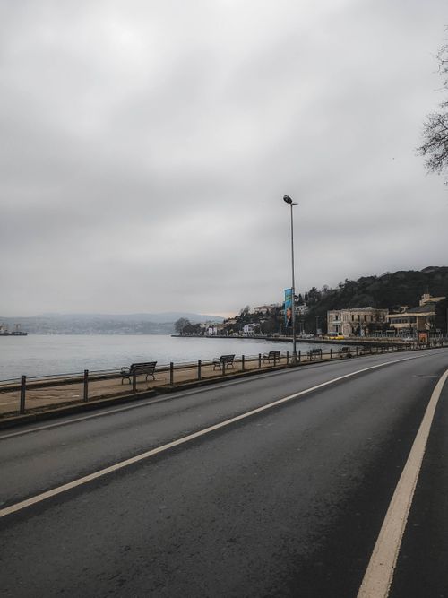 Free Empty road along Bosphorus Strait in Istanbul on a cloudy day. Calm and serene cityscape. Stock Photo
