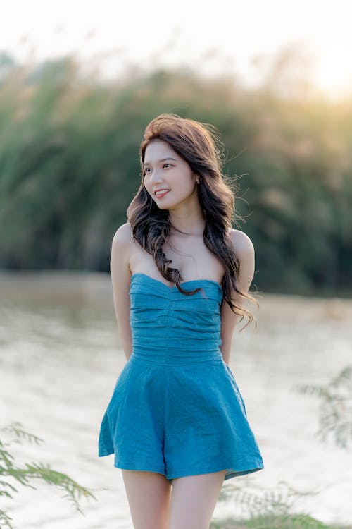 A beautiful asian woman in a blue dress