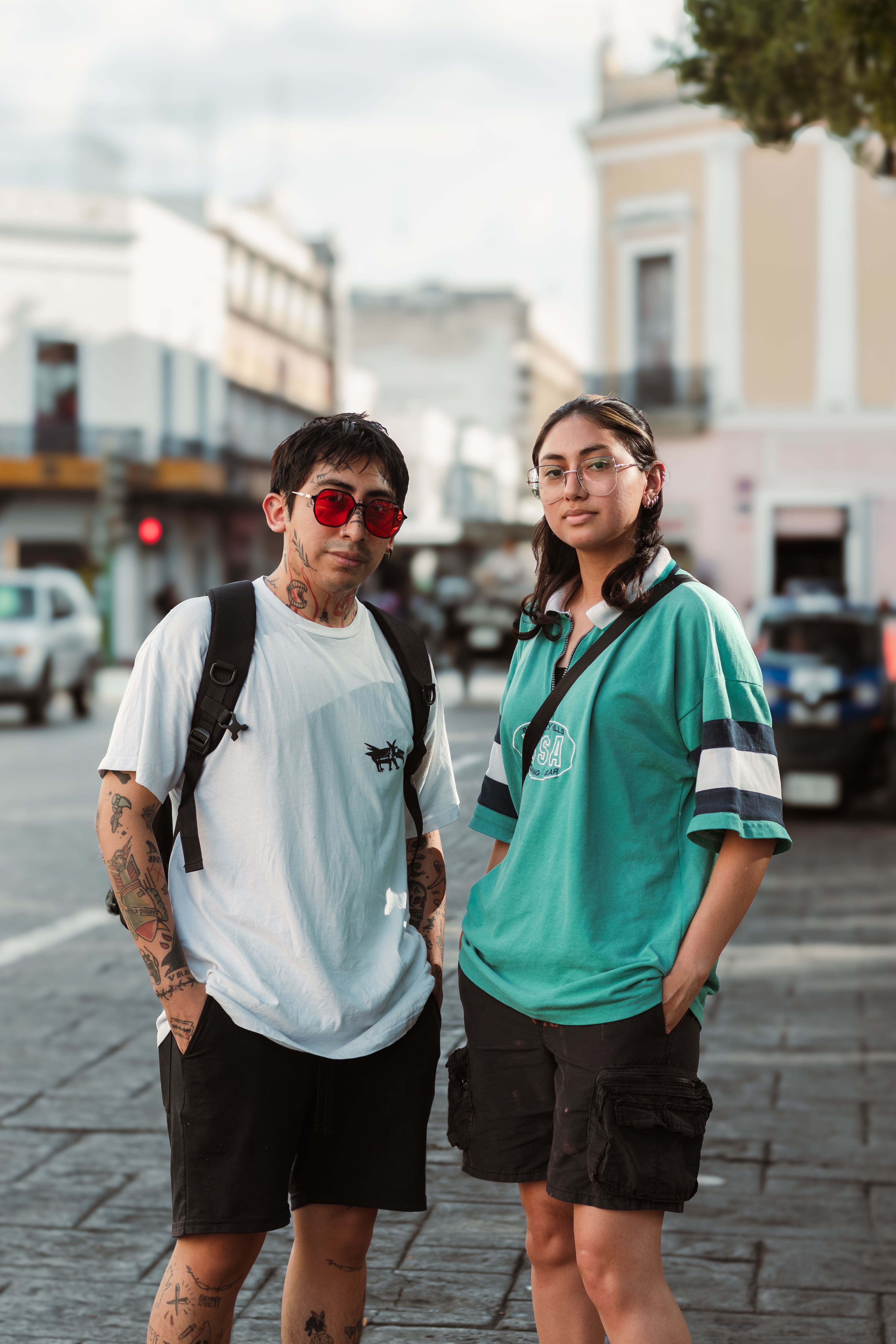 Young Man and Woman in Casual Clothing Standing on a Sidewalk · Free ...