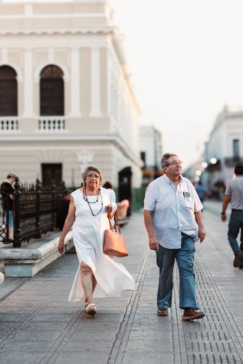 Couple walking down a street in old town
