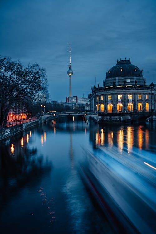 A boat passes by a building in berlin