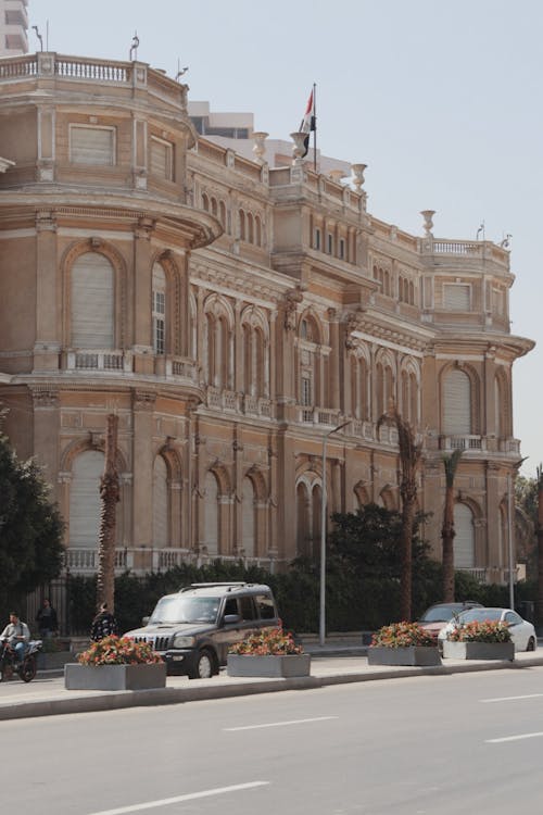 A large building with many windows and a clock on top