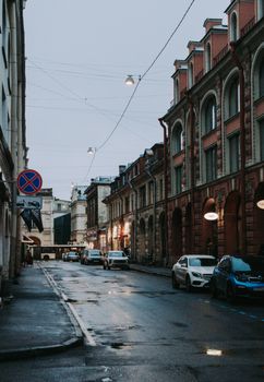A rainy evening in Saint Petersburg capturing historic architecture and urban life.
