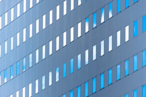 A close up of a building with blue windows