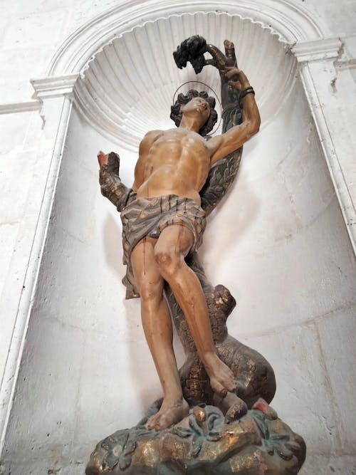 Free Low Angle Shot of a Religious Sculpture  Stock Photo