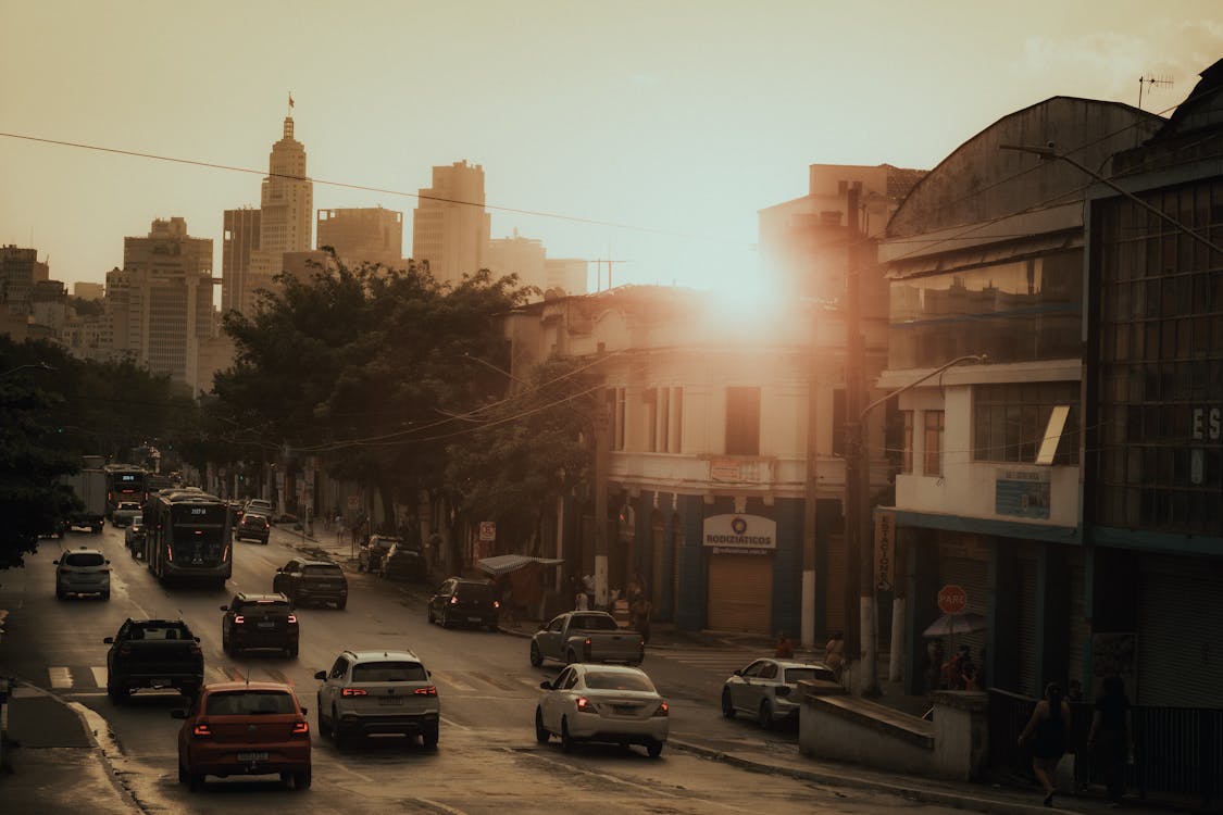 A city street with cars and buildings in the background