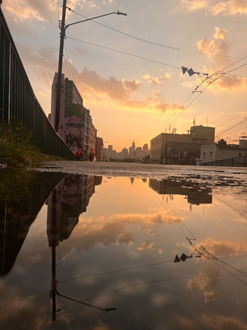 A reflection of the sunset on a puddle