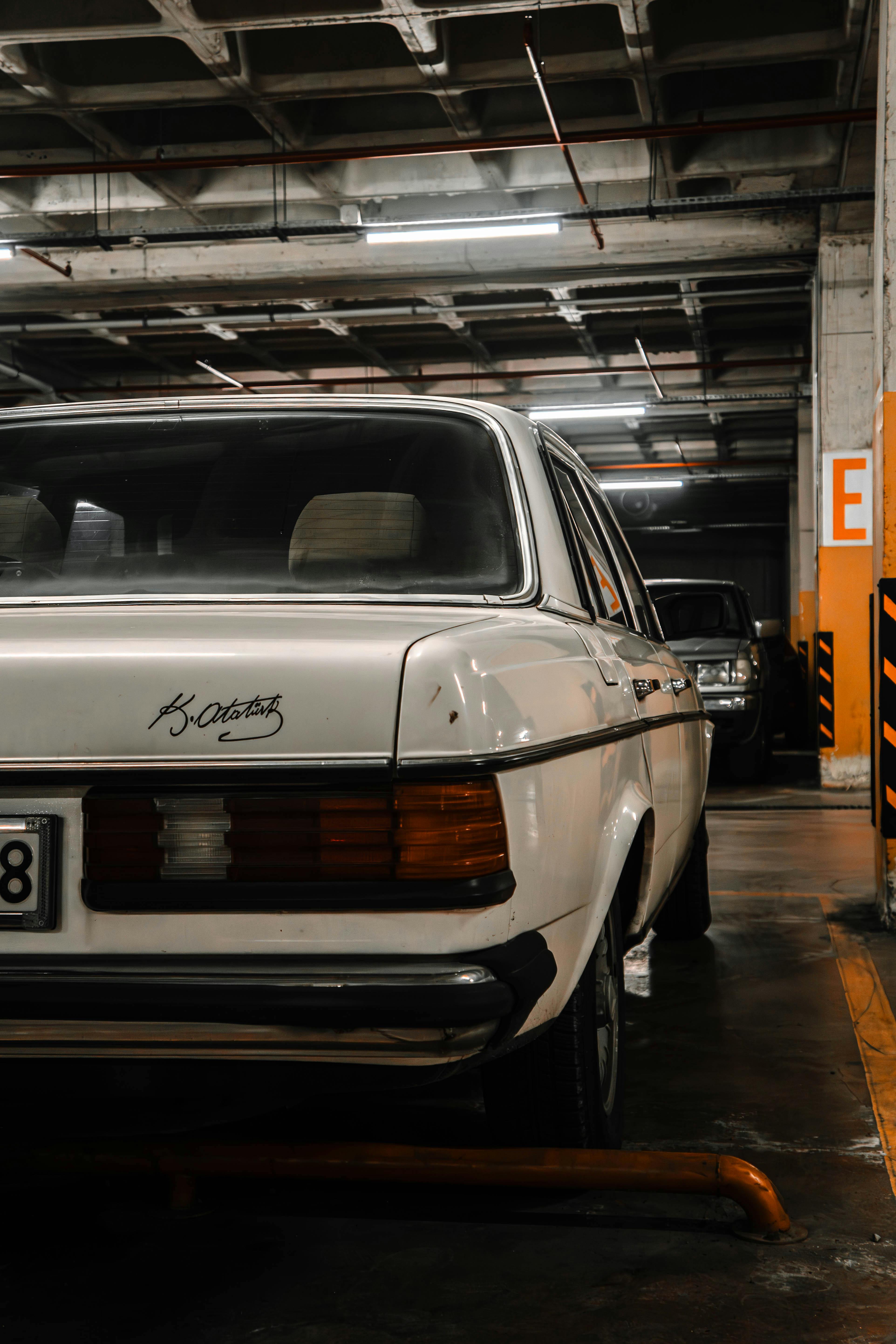 Free Retro white car parked in an İstanbul garage, showcasing classic automotive design. Stock Photo
