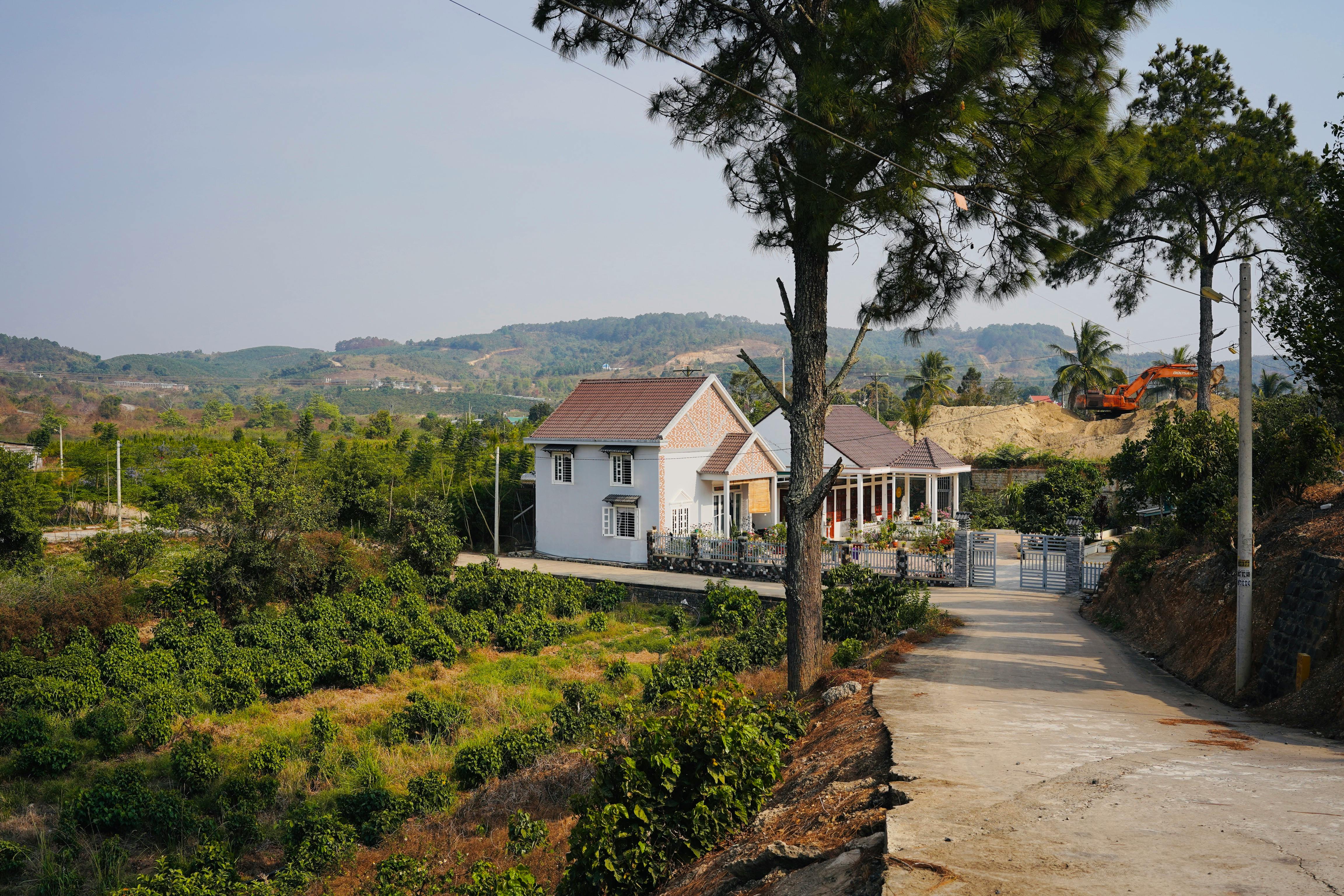 Free Photo Of View Of A Cropland And A House In The Countryside