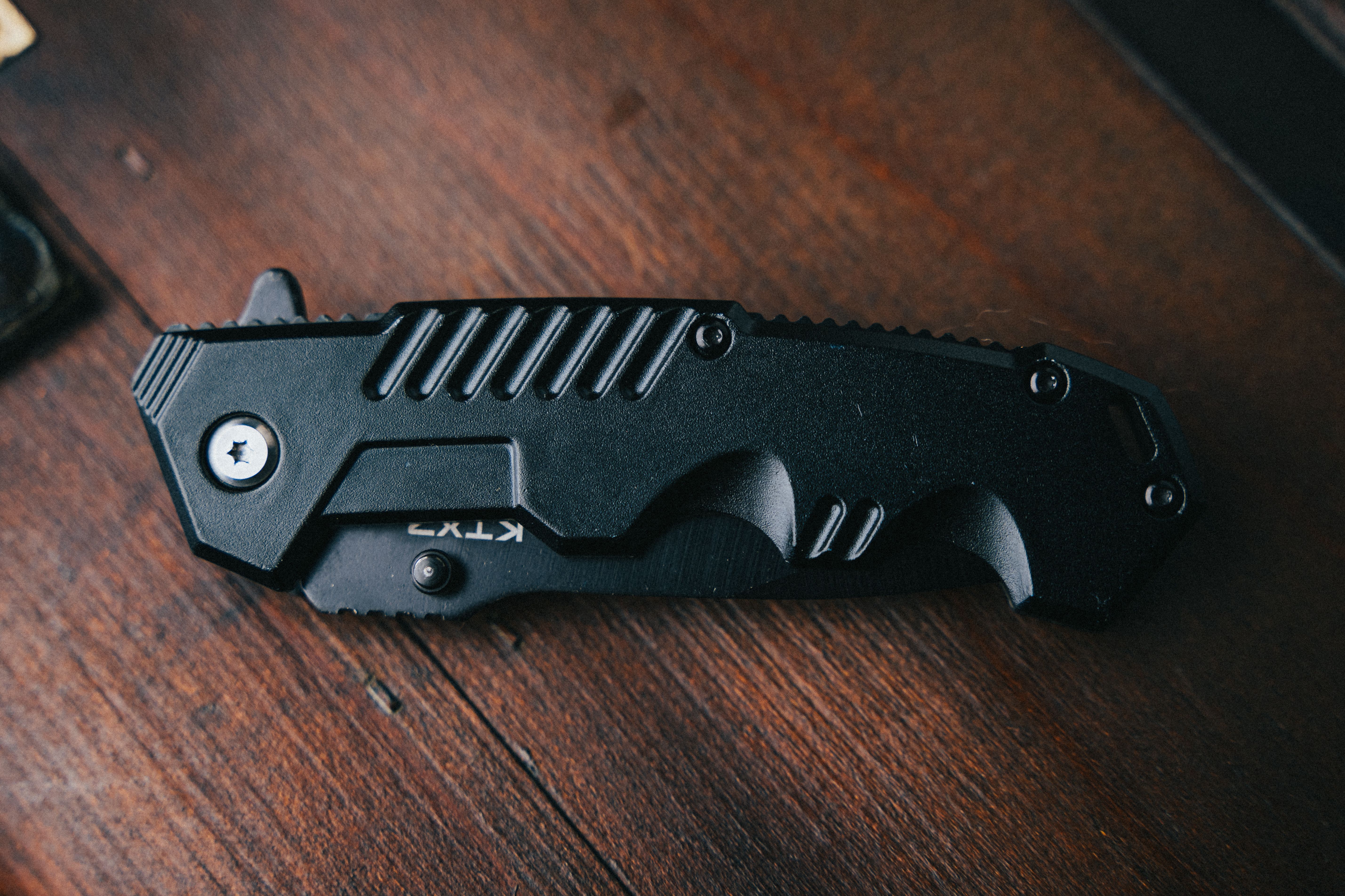 black oscillating multitool on wooden workbench closeup