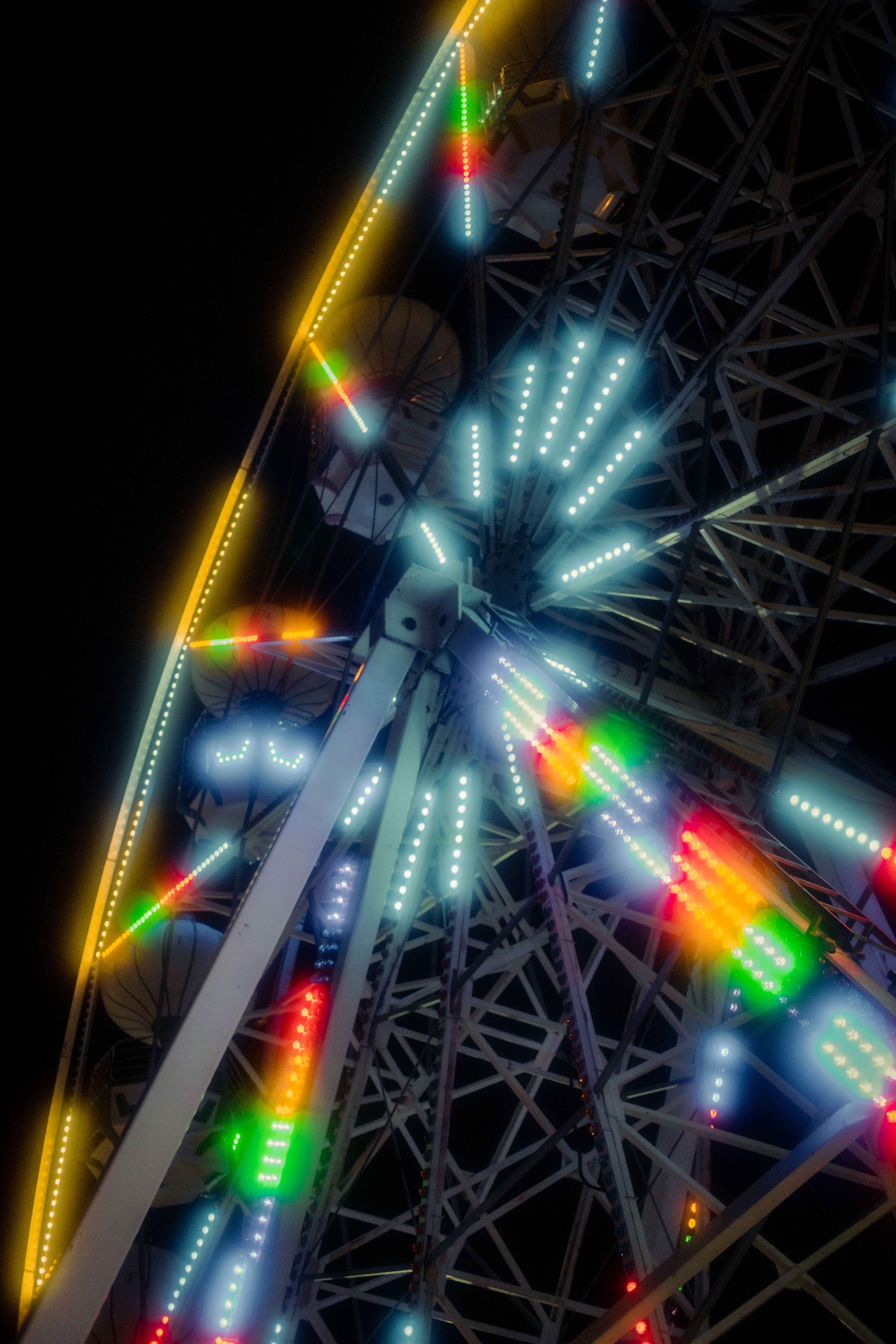 A ferris wheel with colorful lights at night · Free Stock Photo