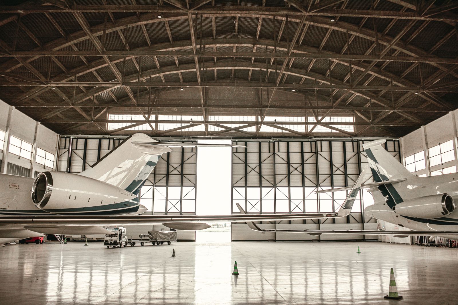 Private jets parked inside a hangar