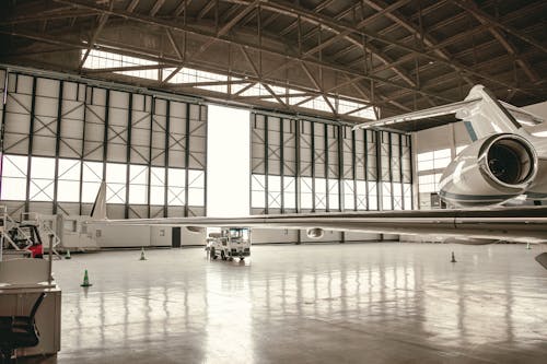 A large airplane inside of a hangar