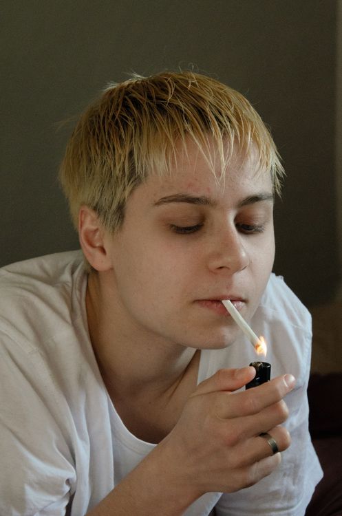 Blonde Woman Smoking a Cigarette · Free Stock Photo
