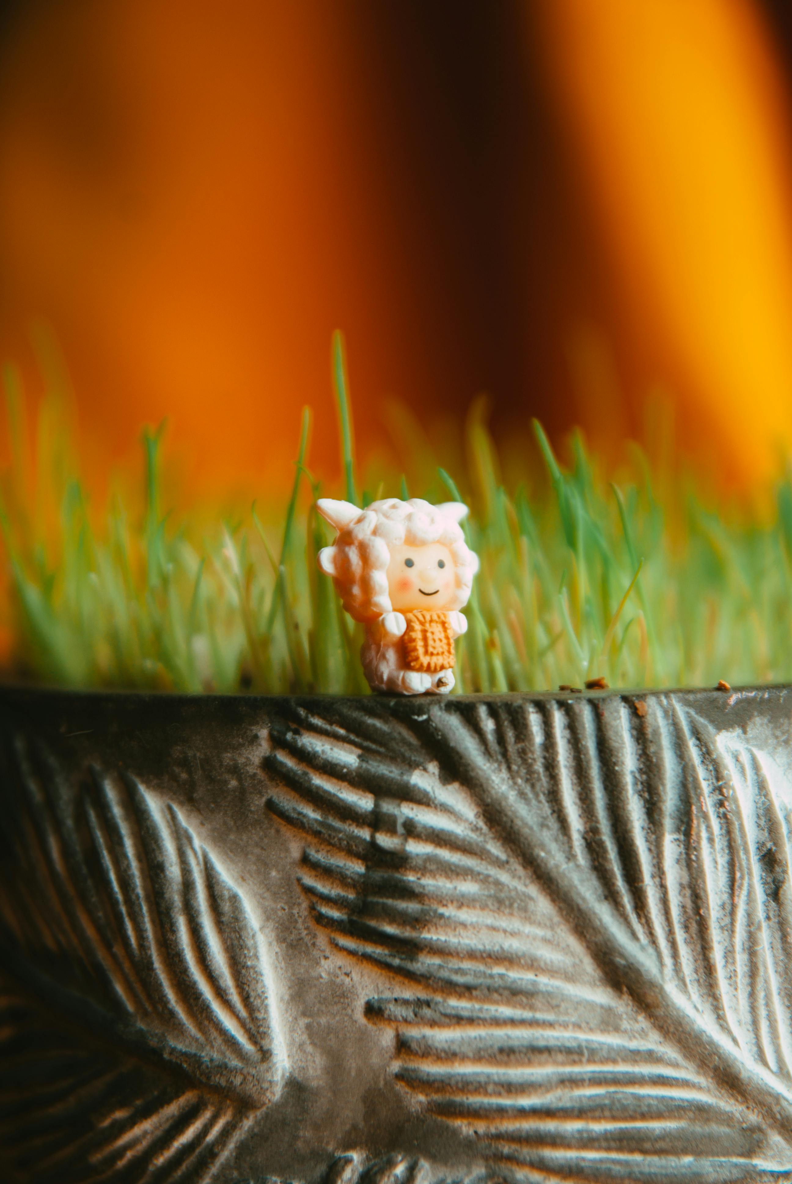 adorable figurine decorating potted plant