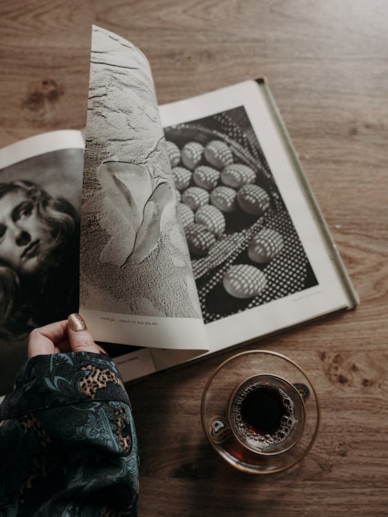 Woman Hand Holding Book Page