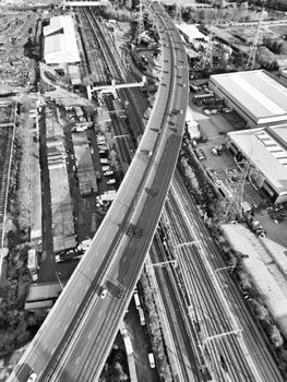 Black and white aerial view of Barking's highway viaduct and railway tracks.