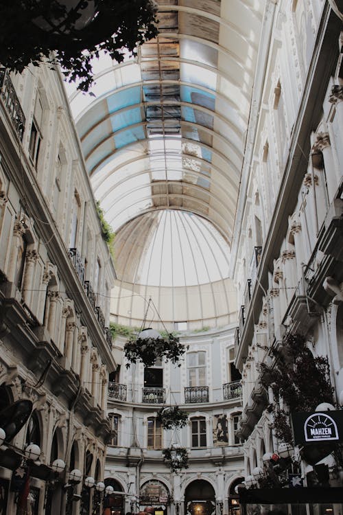A view of a shopping mall with a skylight