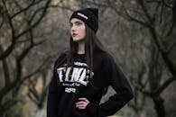 Woman Standing Surrounded by Tress