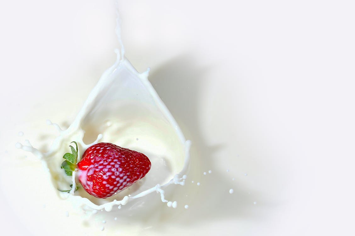 Free Strawberry Fruit dropped in milk Stock Photo