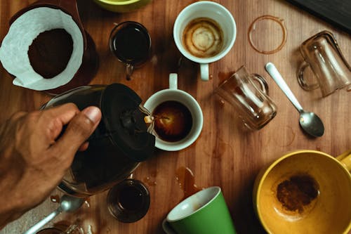 Free Man Hand Pouring Coffee Stock Photo