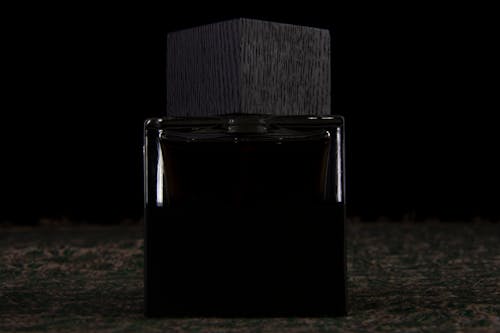 Photography of black cologne in studio space