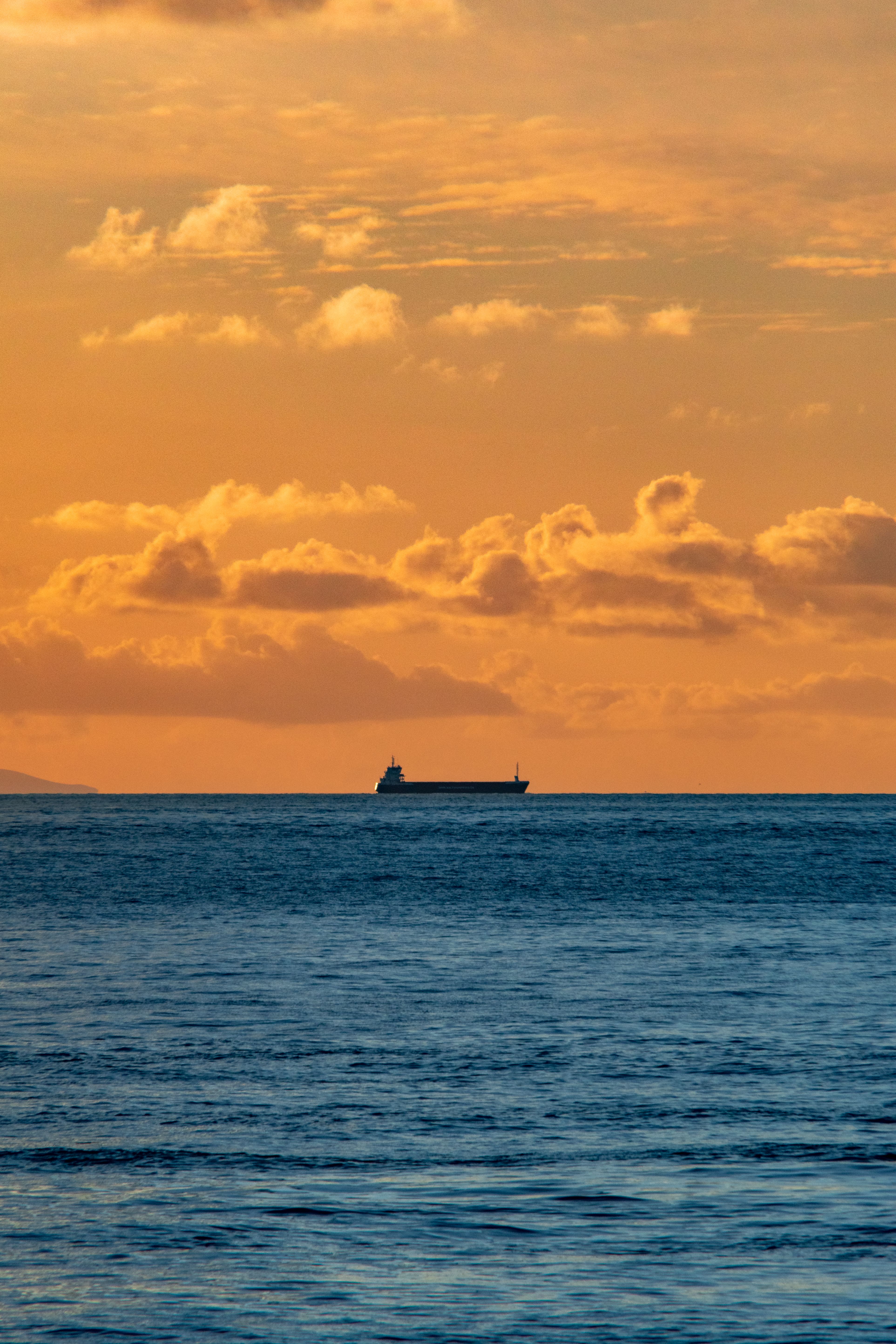 Yellow Sky over Sea at Sunset · Free Stock Photo