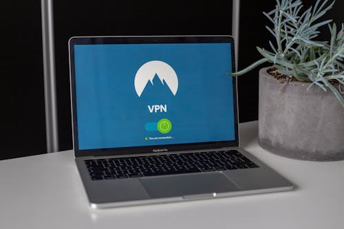 Free Grey and Black Macbook Pro Showing Vpn Stock Photo