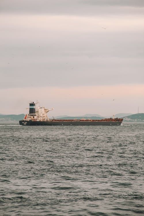 Barge in Sea at Dawn