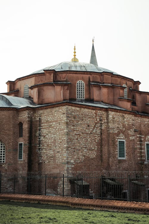 A large brick building with a dome on top
