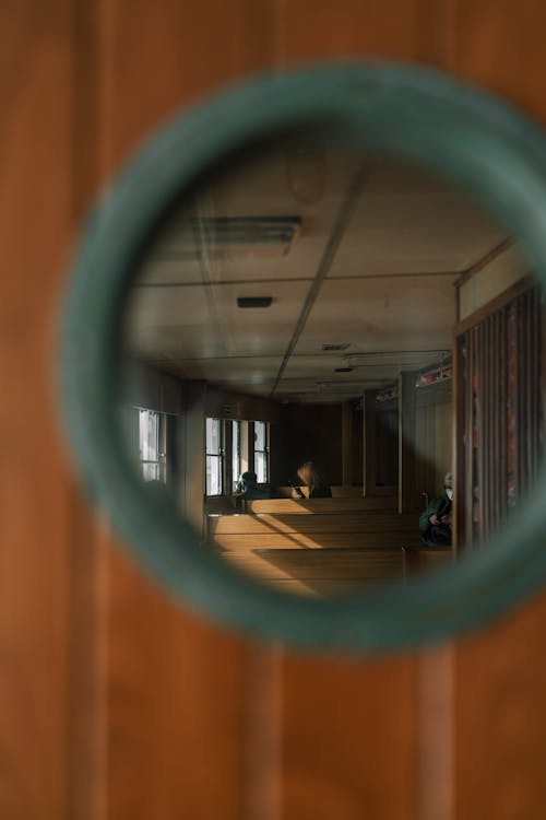 Passenger Lounge Seen through Round Window in Door