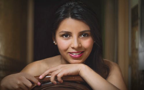 Free A woman with long hair posing for a portrait Stock Photo