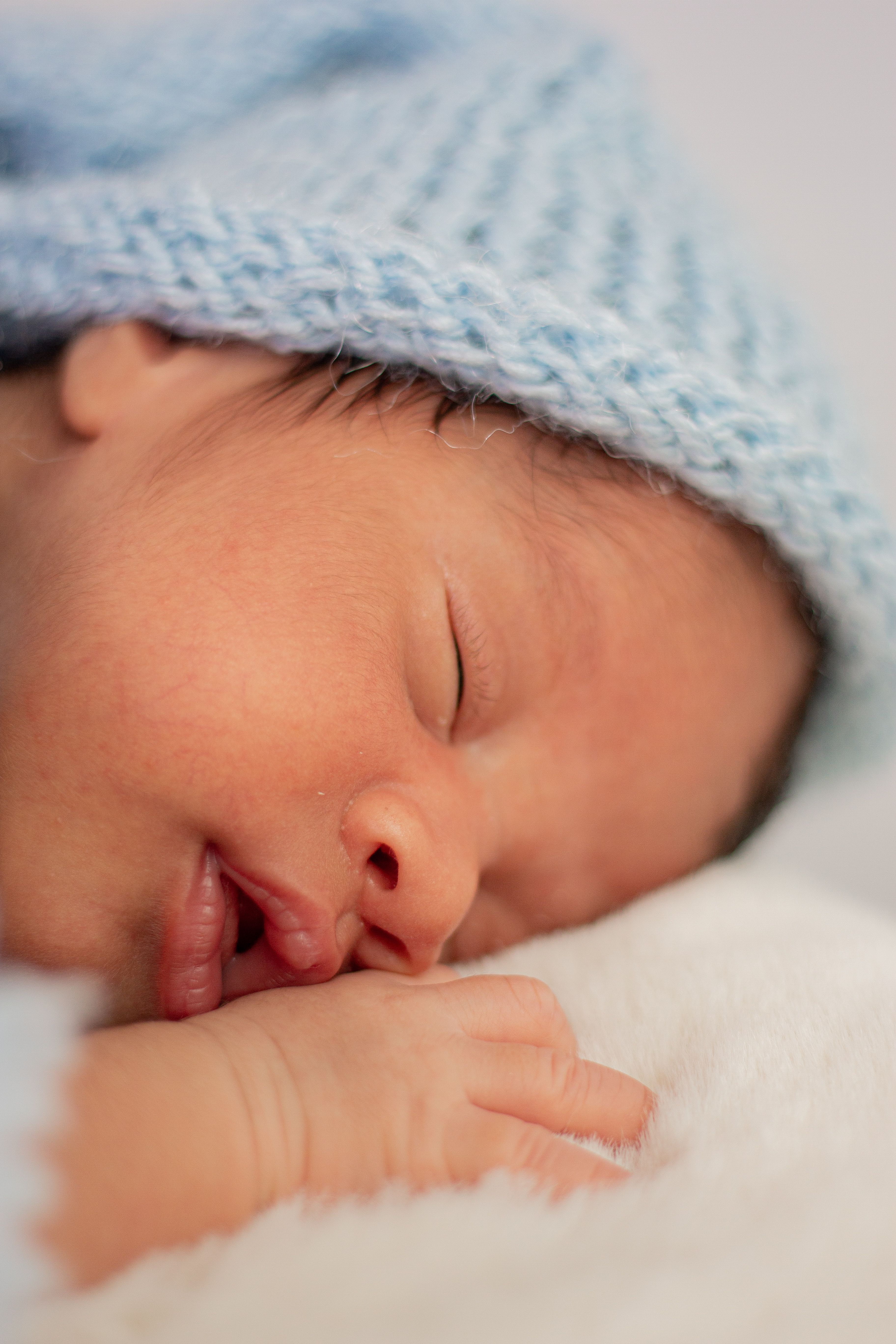 A close-up of a sleeping newborn