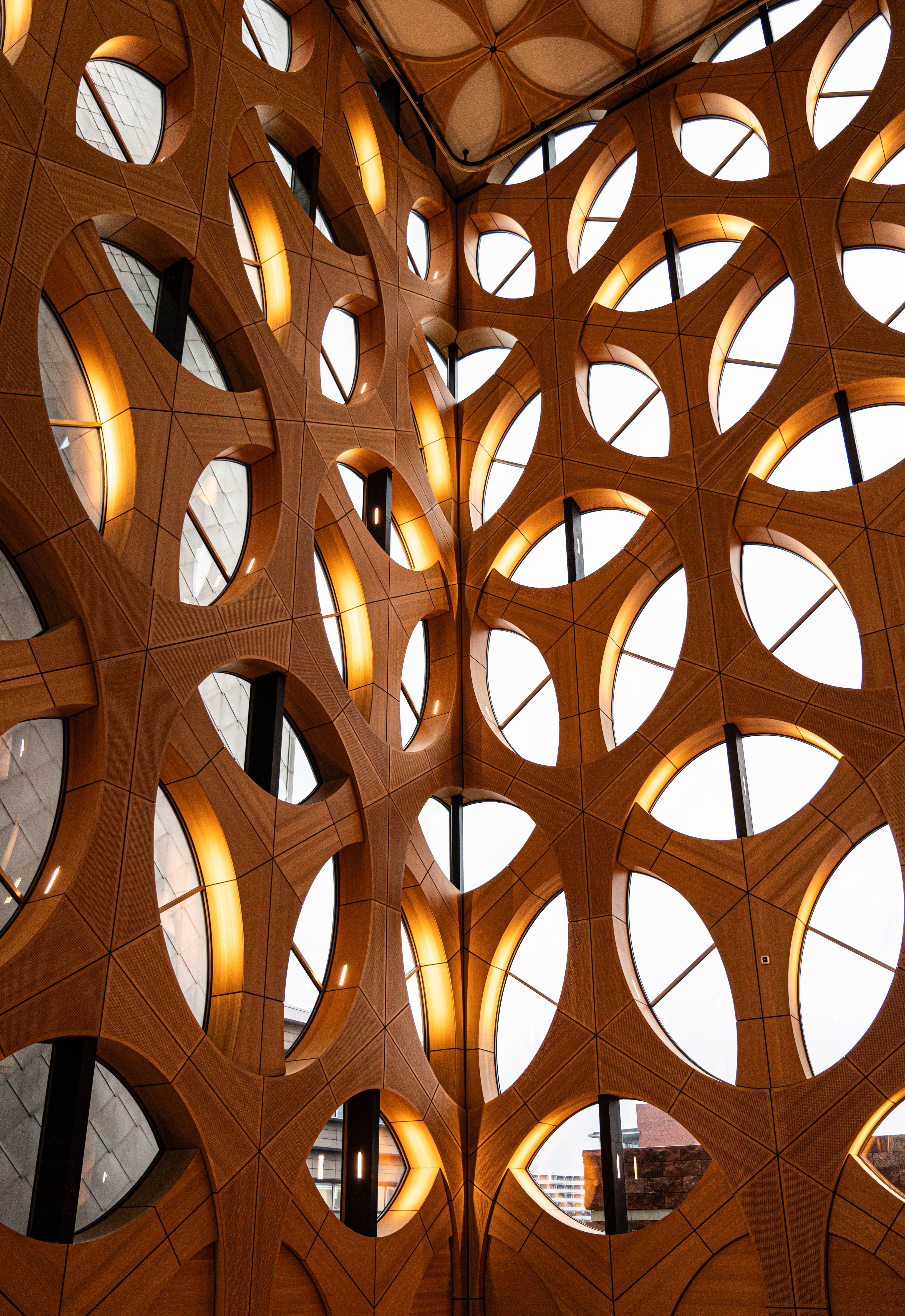 The inside of a building with a large wooden structure · Free Stock Photo