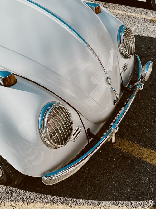 Free High angle view of a vintage Volkswagen Beetle in a parking lot. Stock Photo