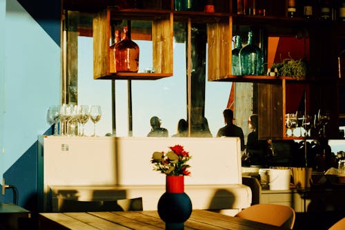 Red Flower in Vase on Table in Luxury Restaurant