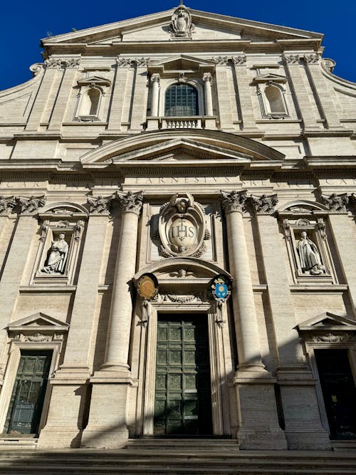 The facade of a church with a clock on it