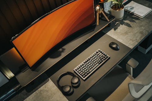 A desk with a keyboard and mouse on it