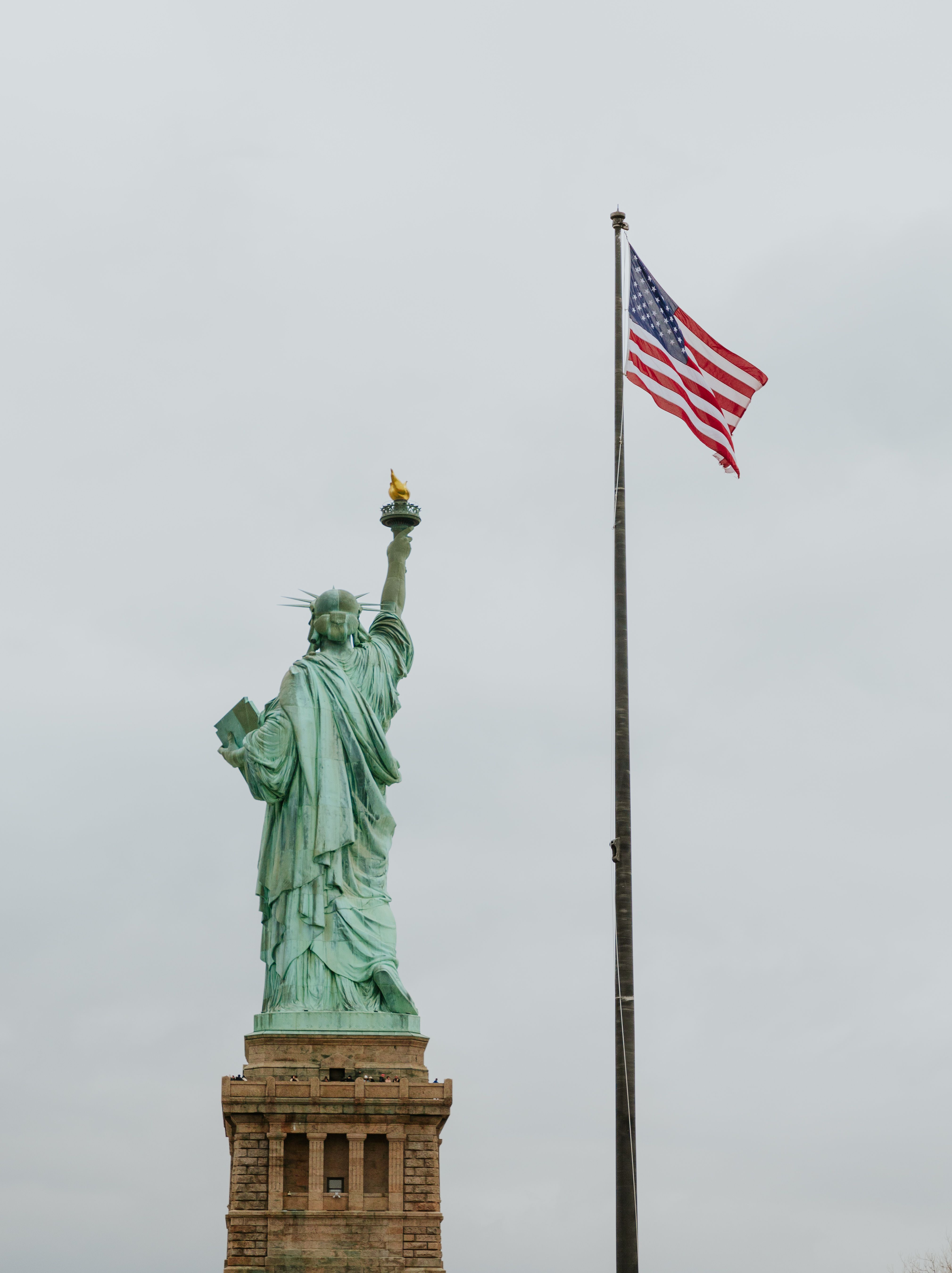 Statue of Liberty and Flag of USA · Free Stock Photo