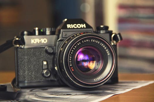 Close-up of a classic Ricoh KR-10 camera with a Carl Zeiss Jena lens, showcasing vintage photography equipment.