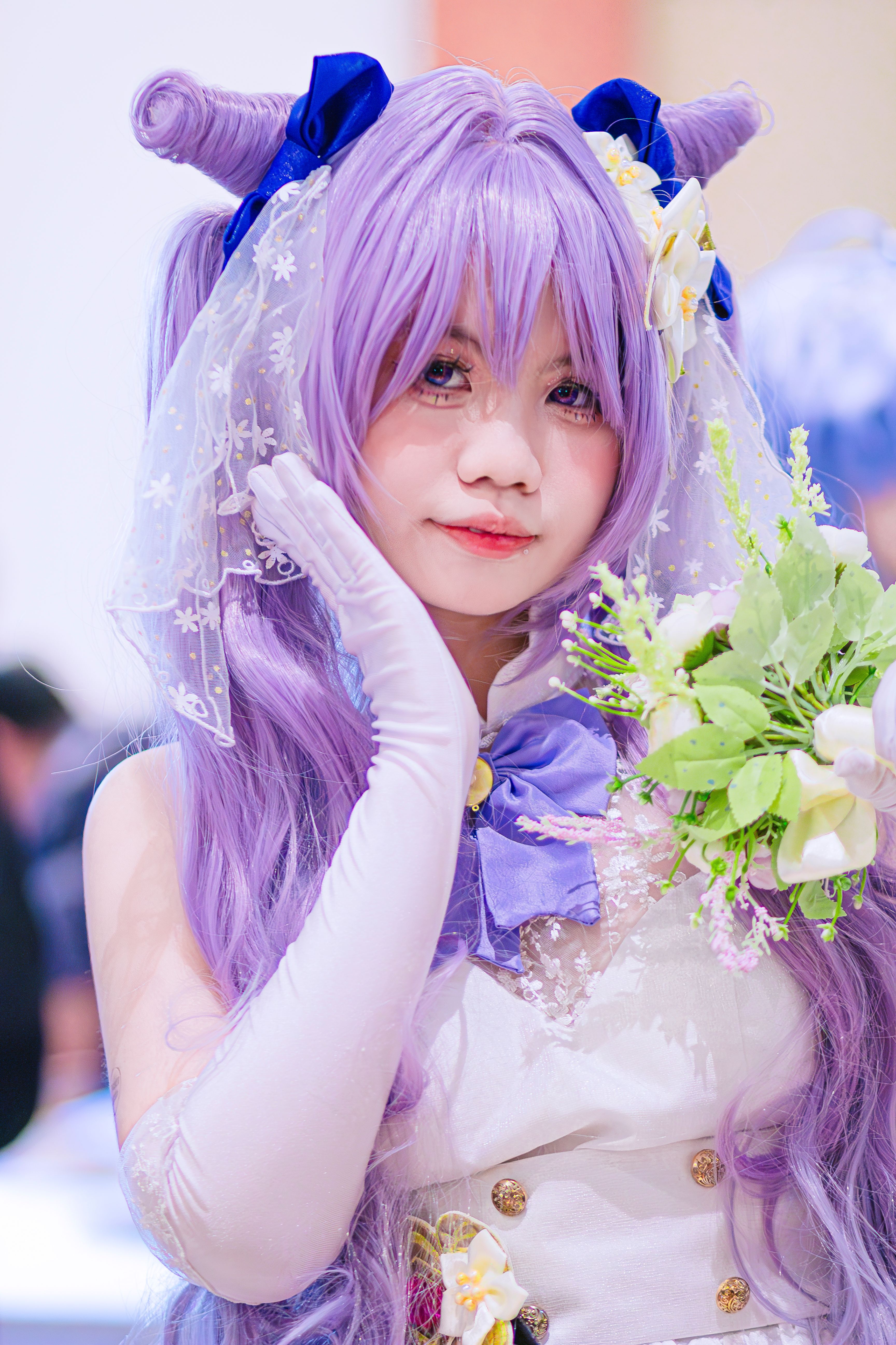 A colorful anime-inspired cosplay portrait featuring a woman with a lavender wig and floral accessories.