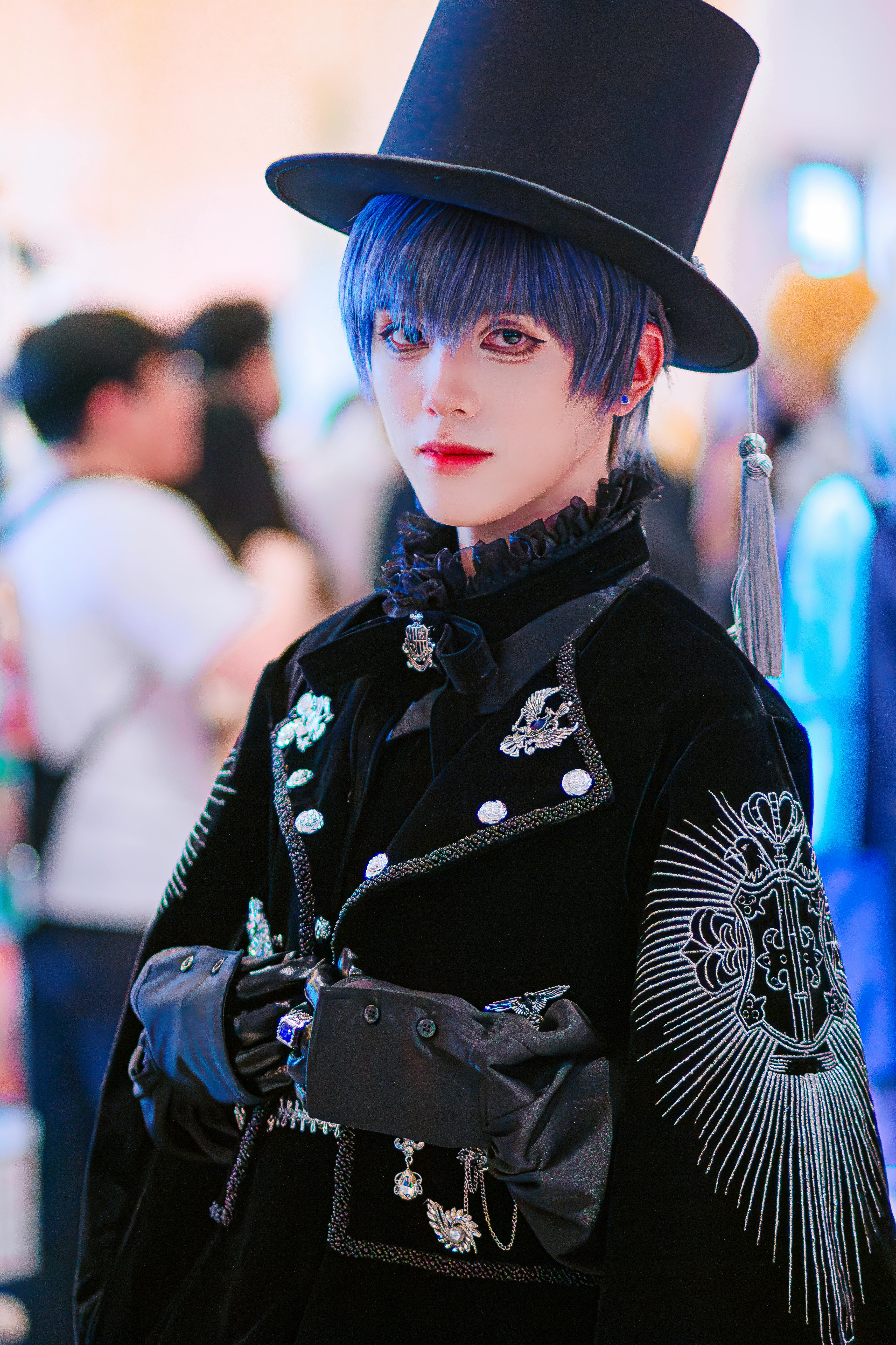 Person in elaborate cosplay with top hat and ornate attire, perfect for themed events.