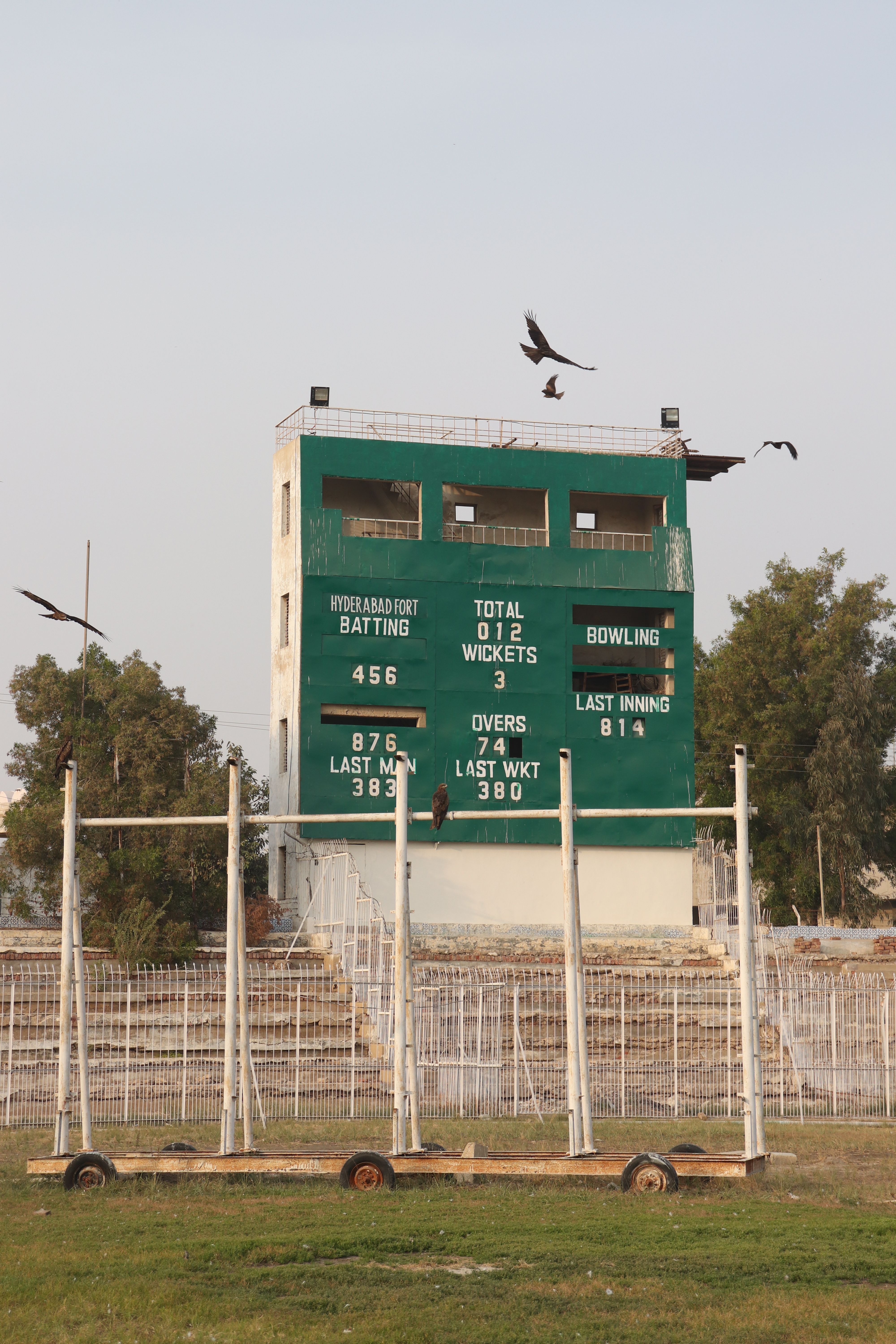 A smartphone screen displaying real-time cricket data with a low latency cricket app interface.