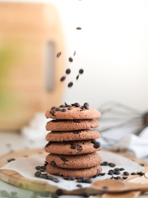 A stack of chocolate chip cookies with chocolate chips