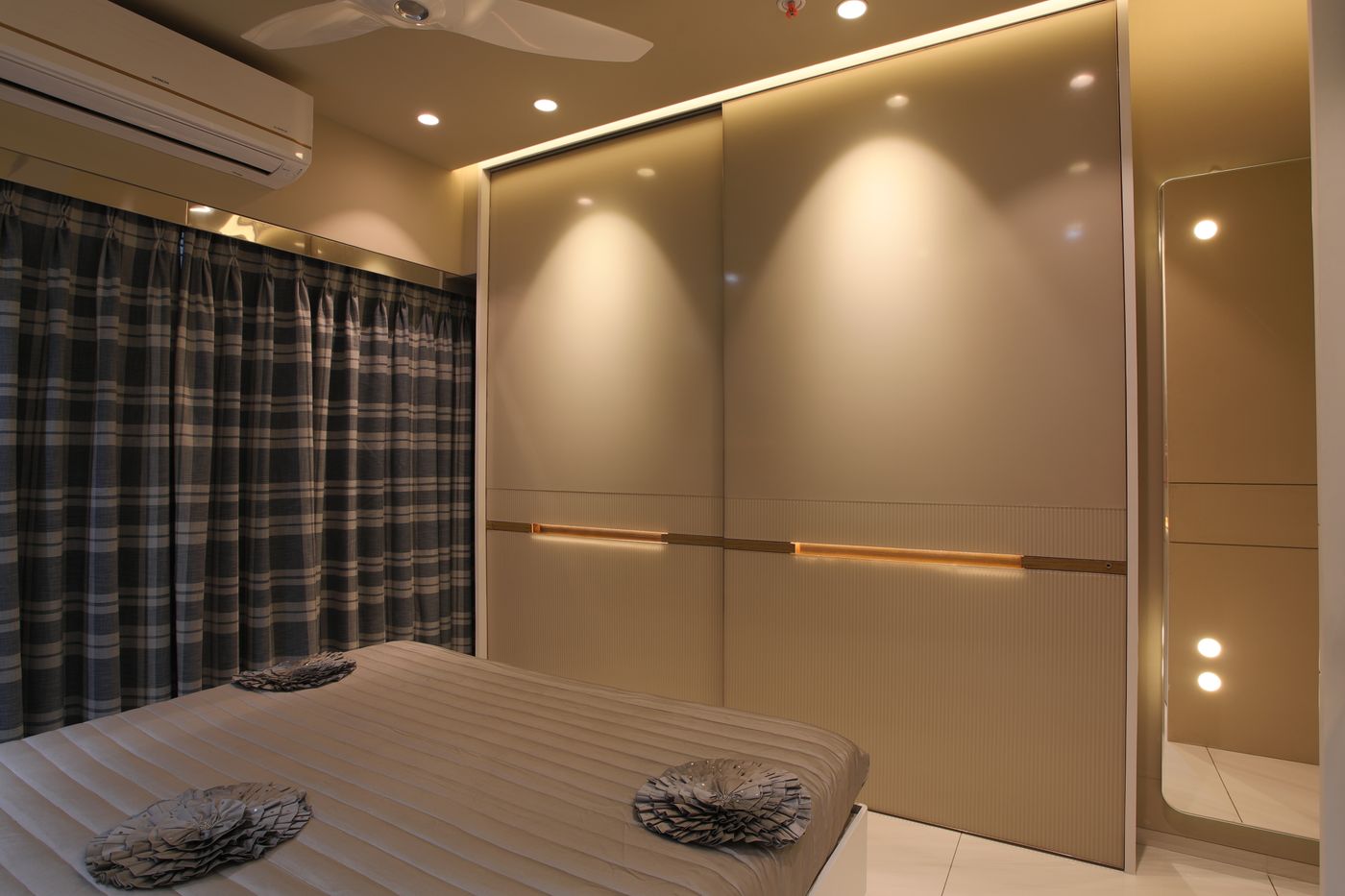 Modern bedroom with ambient and recessed interior lighting