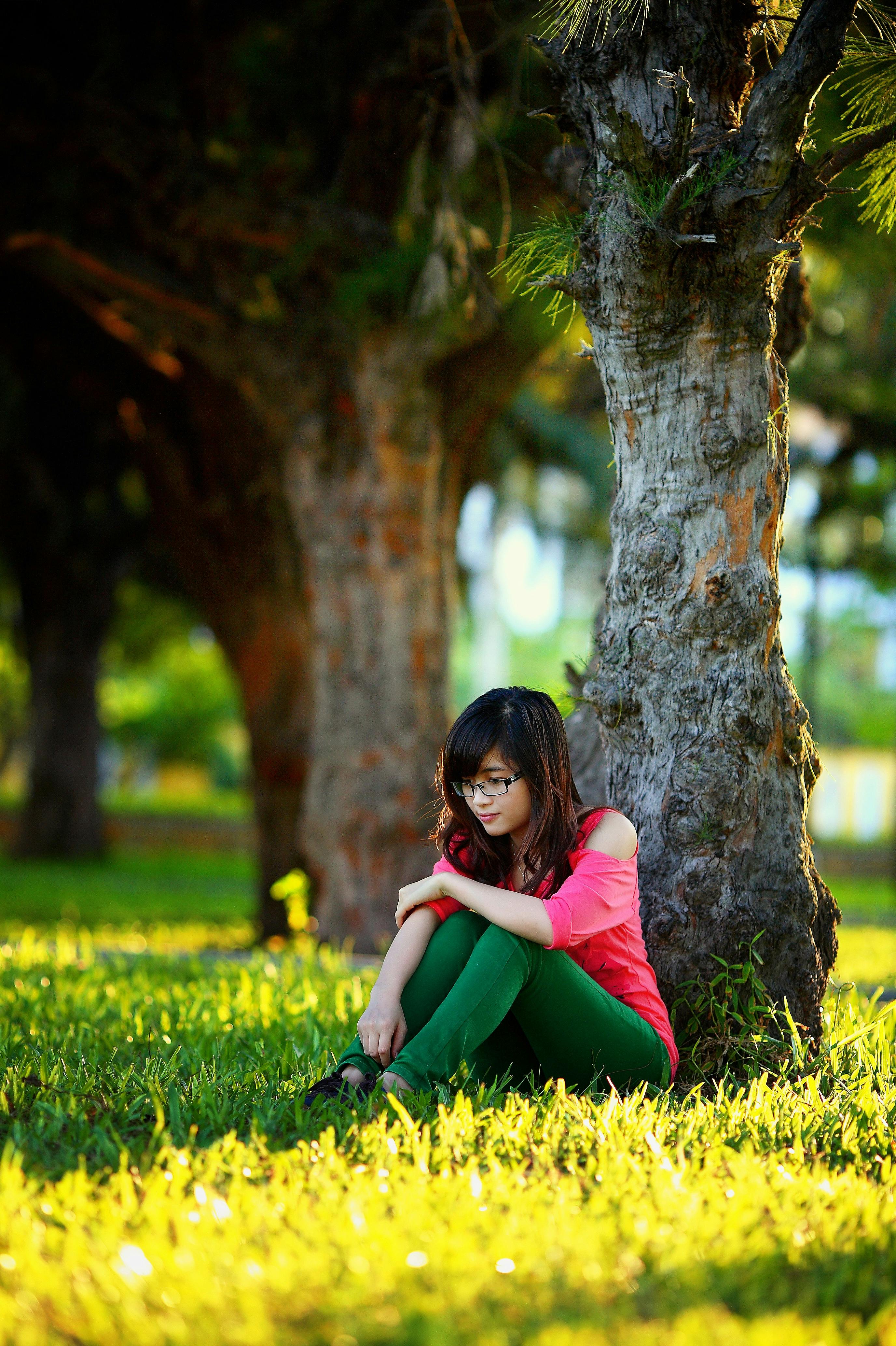 Woman Sitting Under a Tree