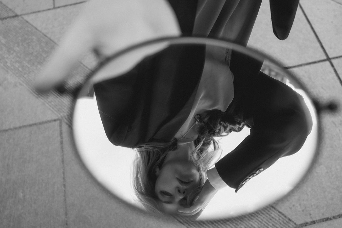 Inverted Mirror. View Inverted Reflection of a Beautiful Woman in a Small Mirror · Free Stock ...